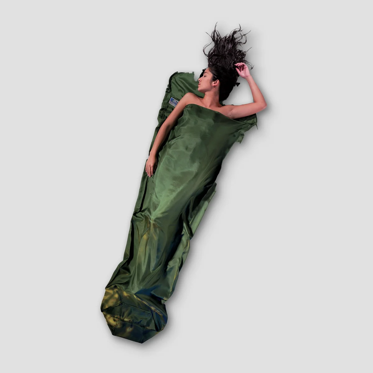 COCOON hammock, MummyLiner Silk, and tree straps laid out side by side showing total packed system