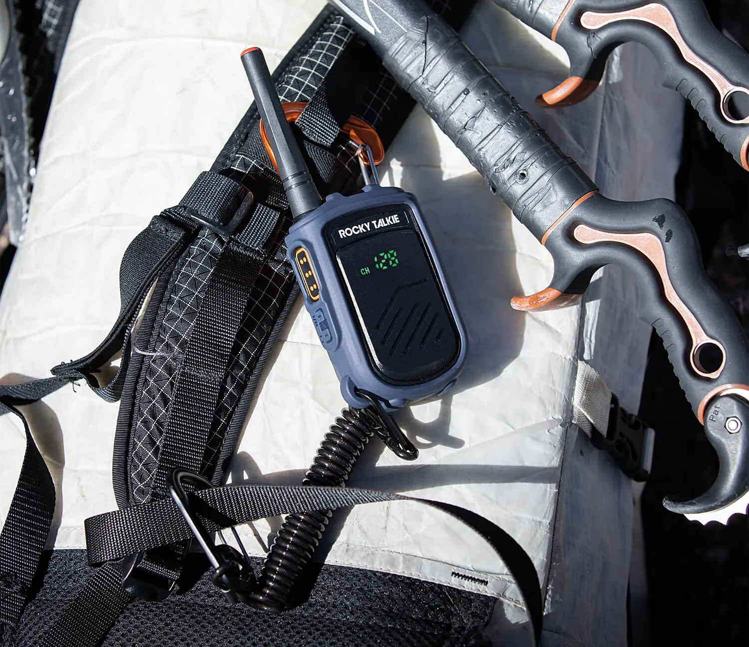 Rockie Talkie Mountain Radio attached to a climbing backpack
