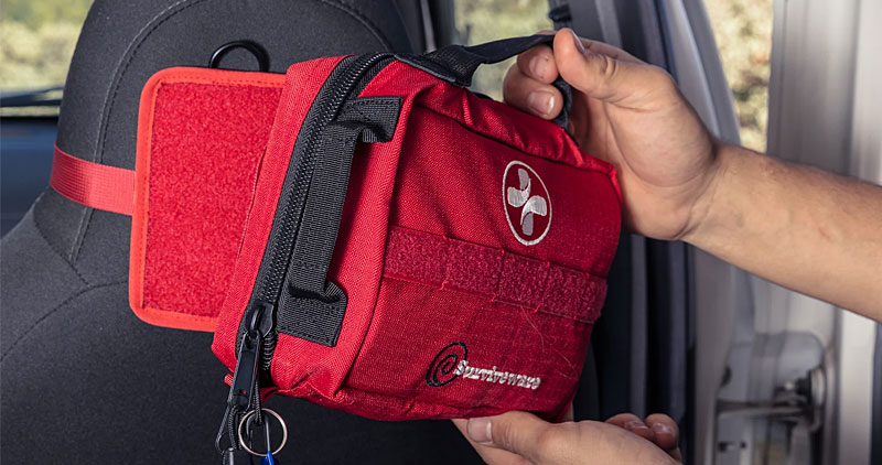 Surviveware First Aid Kit In A Vehicle mounted to a headrest