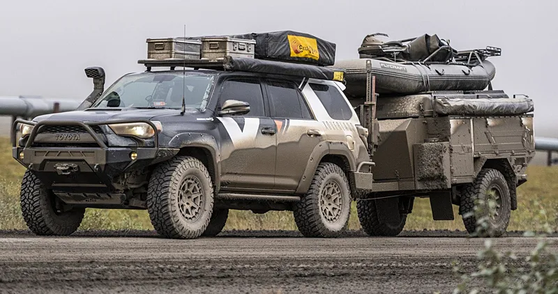 Toyota 4Runner towing an overland trailer loaded with gear, a compact and capable bug out vehicle