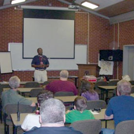 ARRL Radio Class with a lecturer in front of a projection screen