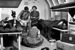 An old time emergency bomb shelter with a family inside