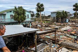 David Hester inspects damages of his house after Hurricane Helene made landfall in Horseshoe Beach, Florida, on September 28, 2024. Chandan Khanna/AFP via Getty Images