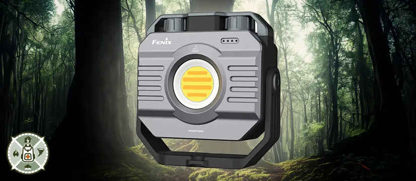 A Fenix CL28R Lantern superimposed over an image of a forest
