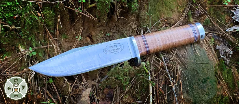 Fallkniven Northern Light Frej Model NL4 laying on a woodland floor